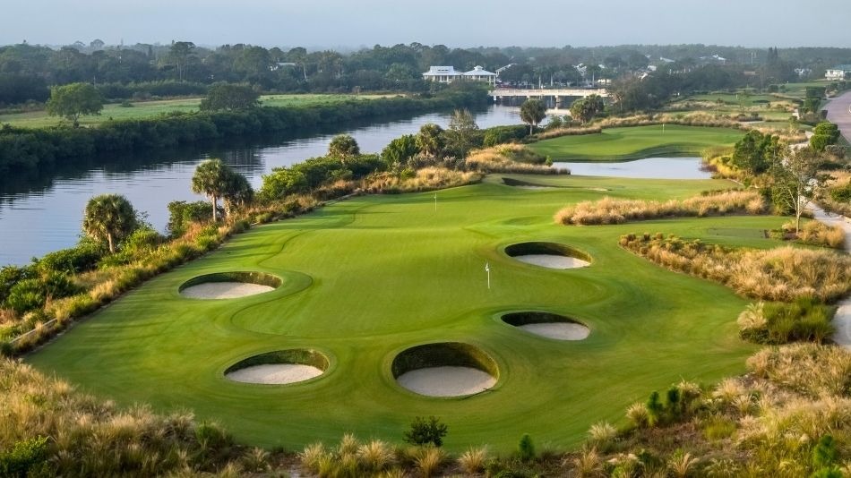 Golf green, bunkers and waterway at The Floridian Golf Club